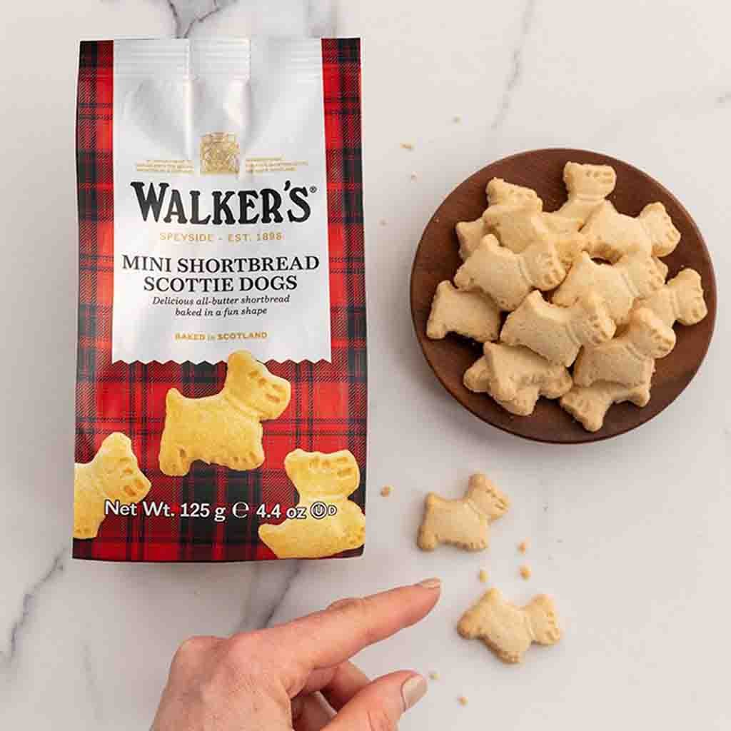 https://www.lebensmittel-sonderposten.de/media/image/6c/ae/f2/Walkers_mini_Shrtbread_Scottie_Dogs_125g_front2_96dpi.jpg